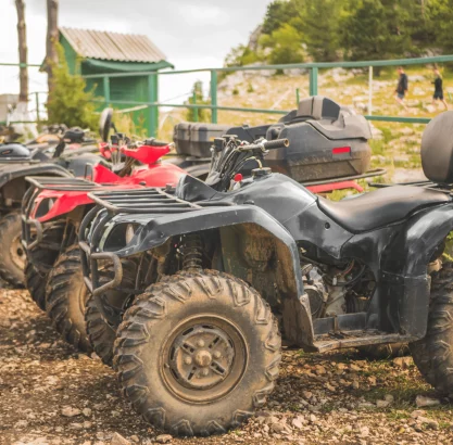row-atv-power-bikes-summer-day-mountain-parking-zone-min